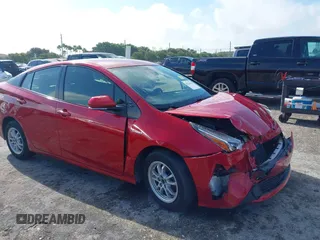 2021 Toyota Prius L Eco with VIN JTDKAMFU4M3145215, listed as a IAAI auction lot 41926274 with 74,220 mi miles. Bid and sale history available at carsss.com. Image 1.
