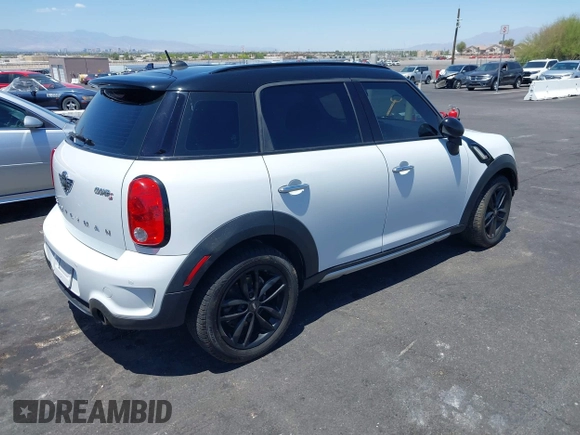 2015 MINI Countryman S with VIN WMWZC3C58FWT05613, listed as a IAAI auction lot 42374870 with 124,214 mi miles and . Bid and sale history available at DreamBid. Image 4.