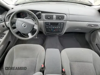2004 Mercury Sable GS z VIN 1MEFM50U34G601378, wystawiony jako Copart lot #56952825 z przebiegiem 63 456 mil mil oraz Tytuł czysty. Historia ofert i sprzedaży dostępna na DreamBid. Obrazek 8.