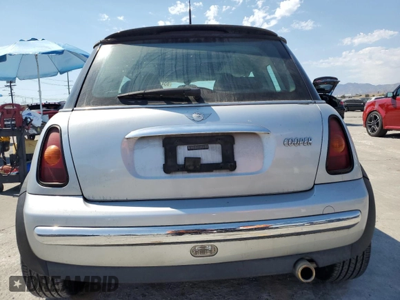 2003 MINI Hardtop with VIN WMWRC33453TE14909, listed as a Copart auction lot 65419725 with 111,960 mi miles and Salvage title. Bid and sale history available at DreamBid. Image 6.