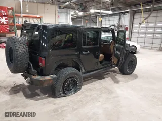 2011 Jeep Wrangler Unlimited Sahara with VIN 1J4HA5H12BL557059, listed as a IAAI auction lot 41856882 with 150,683 mi miles. Bid and sale history available at carsss.com. Image 4.