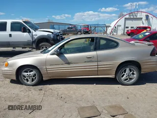 2001 Pontiac Grand Am z VIN 1G2NF12T51M534918, wystawiony jako IAAI lot #42055289 z przebiegiem 128 155 mil mil oraz . Historia ofert i sprzedaży dostępna na DreamBid. Obrazek 15.