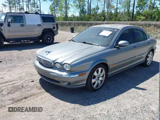 2004 Jaguar X-Type with VIN SAJEA51C04WD73023, listed as a IAAI auction lot 41874488 with 199,333 mi miles and . Bid and sale history available at DreamBid. Image 2.