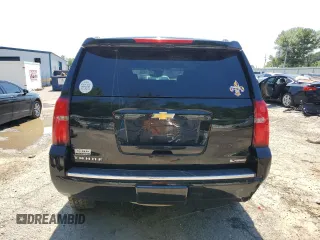 2018 Chevrolet Tahoe Premier with VIN 1GNSKCKC1JR133625, listed as a Copart auction lot 54900974 with 130,921 mi miles and Salvage title. Bid and sale history available at DreamBid. Image 6.