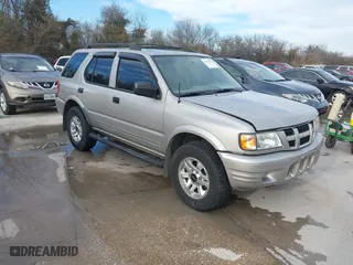2004 Isuzu Rodeo S with VIN 4S2CK58W344311048, listed as a IAAI auction lot 41472392 with 128,732 mi miles. Bid and sale history available at carsss.com. Image 1.