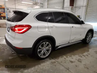 2018 BMW X1 xDrive28i with VIN WBXHT3C30J5K29917, listed as a Copart auction lot 56165845 with 131,876 mi miles and Salvage title. Bid and sale history available at DreamBid. Image 3.