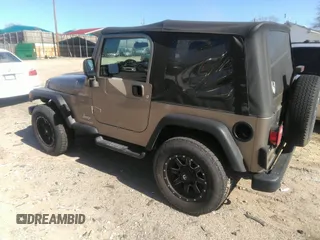 2003 Jeep Wrangler Sport with VIN 1J4FA49S53P365363, listed as a IAAI auction lot 41818320 with 154,567 mi miles. Bid and sale history available at carsss.com. Image 3.