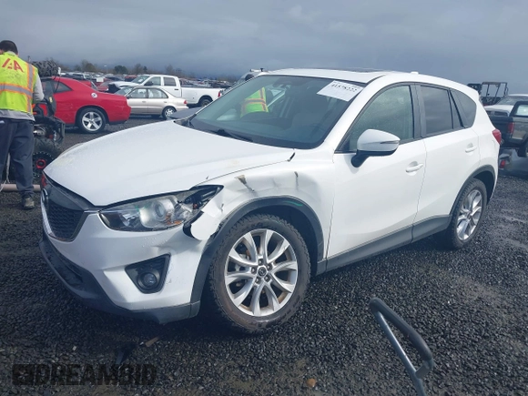 2015 Mazda CX-5 Grand Touring with VIN JM3KE4DY0F0483037, listed as a IAAI auction lot 41578222 with 102,988 mi miles. Bid and sale history available at carsss.com. Image 2.