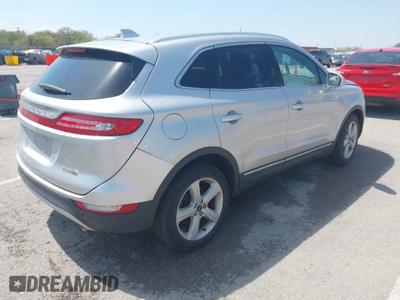 2015 Lincoln MKC with VIN 5LMCJ2A94FUJ16038, listed as a IAAI auction lot 42057400 with 102,848 mi miles. Bid and sale history available at carsss.com. Image 4.