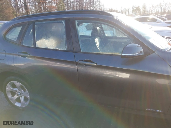 2014 BMW X1 sDrive28i with VIN WBAVM1C52EVW55890, listed as a IAAI auction lot 41512784 with 97,718 mi miles. Bid and sale history available at carsss.com. Image 13.