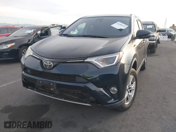 2018 Toyota RAV4 XLE with VIN JTMWFREV2JJ151595, listed as a IAAI auction lot 41380691 with 79,515 mi miles and . Bid and sale history available at carsss.com. Image 2.