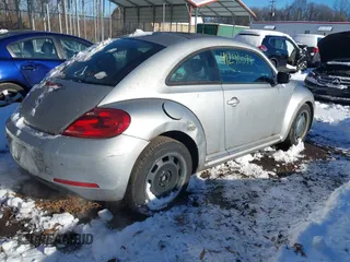 2012 Volkswagen Beetle 2.5L PZEV with VIN 3VWJP7AT4CM601556, listed as a IAAI auction lot 41240071 with 113,338 mi miles. Bid and sale history available at carsss.com. Image 4.