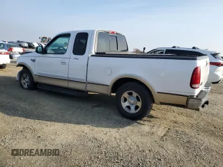 1999 Ford F-150 XL with VIN 1FTRX17L2XKC10123, listed as a Copart auction lot 83158894 with 57,446 mi miles and Salvage Title. Bid and sale history available at carsss.com. Image 2.