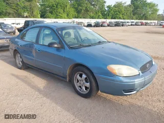 2006 Ford Taurus SE with VIN 1FAFP53U26A179541, listed as a IAAI auction lot 42000612 with 214,881 mi miles. Bid and sale history available at carsss.com. Image 1.