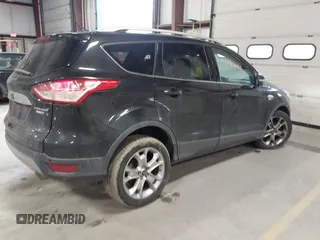 2015 Ford Escape Titanium z VIN 1FMCU0JX9FUB48089, wystawiony jako IAAI lot #41048127 z przebiegiem 133 439 mil mil oraz . Historia ofert i sprzedaży dostępna na DreamBid. Obrazek 4.