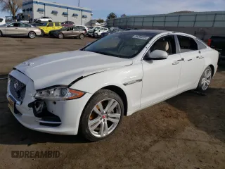 2014 Jaguar XJ with VIN SAJWA2GZ7E8V69543, listed as a Copart auction lot 86390204 with 110,929 mi miles and Salvage Title. Bid and sale history available at carsss.com. Image 1.