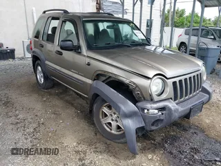 2003 Jeep Liberty Sport z VIN 1J4GK48K63W602709, wystawiony jako IAAI lot #42176496 z przebiegiem 151 397 mil mil oraz . Historia ofert i sprzedaży dostępna na DreamBid. Obrazek 1.