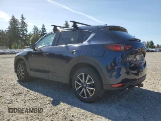 2018 Mazda CX-5 Grand Touring z VIN JM3KFBDM5J0379246, wystawiony jako Copart lot #58587865 z przebiegiem 46 339 mil mil oraz Szkody całkowita. Historia ofert i sprzedaży dostępna na DreamBid. Obrazek 2.