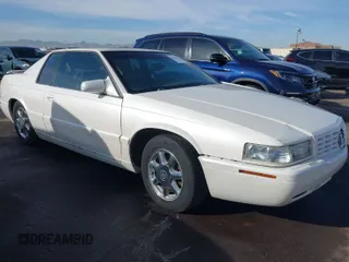 2001 Cadillac Eldorado Touring ETC z VIN 1G6ET12991B104624, wystawiony jako IAAI lot #41616324 z przebiegiem Nie podano mil oraz . Historia ofert i sprzedaży dostępna na DreamBid. Obrazek 1.