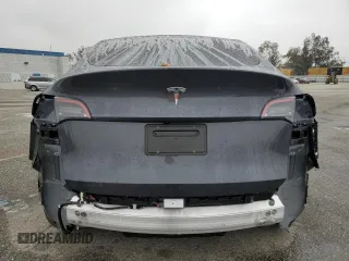 2024 Tesla Model Y with VIN 7SAYGDED5RF093410, listed as a Copart auction lot 50557225 with 6,396 mi miles and Salvage Title. Bid and sale history available at DreamBid. Image 6.