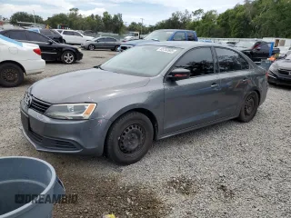 2014 Volkswagen Jetta S with VIN 3VW2K7AJ8EM231099, listed as a Copart auction lot 65752605 with 143,010 mi miles and Salvage title. Bid and sale history available at DreamBid. Image 1.