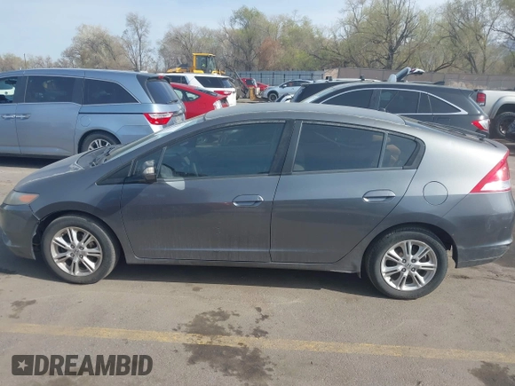 2010 Honda Insight EX with VIN JHMZE2H71AS032532, listed as a IAAI auction lot 41988221 with 333,144 mi miles and . Bid and sale history available at DreamBid. Image 14.