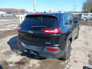 2016 Jeep Cherokee 75th Anniversary with VIN 1C4PJLCB5GW107918, listed as a IAAI auction lot 41923377 with 165,619 mi miles and . Bid and sale history available at DreamBid. Image 4.