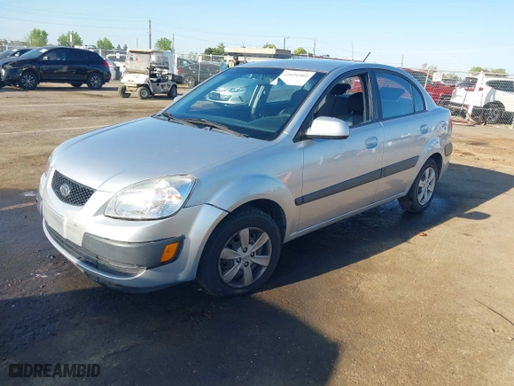 2009 Kia Rio SX with VIN KNADE223296523842, listed as a IAAI auction lot 42024905 with 98,613 mi miles. Bid and sale history available at carsss.com. Image 2.