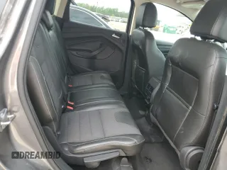 2013 Ford Escape Titanium z VIN 1FMCU0J98DUB64363, wystawiony jako Copart lot #54772925 z przebiegiem 109 956 mil mil oraz Szkody całkowita. Historia ofert i sprzedaży dostępna na DreamBid. Obrazek 11.