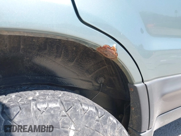 2005 Ford Escape XLS Value z VIN 1FMYU92Z75DA03268, wystawiony jako IAAI lot #42051311 z przebiegiem 124 985 mil mil oraz . Historia ofert i sprzedaży dostępna na DreamBid. Obrazek 6.
