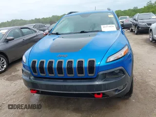 2017 Jeep Cherokee Trailhawk with VIN 1C4PJMBS2HW612792, listed as a IAAI auction lot 42373828 with 74,106 mi miles and . Bid and sale history available at DreamBid. Image 12.