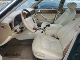 1996 Jaguar XJ with VIN SAJHX1741TC758740, listed as a Copart auction lot 73377914 with 140,964 mi miles and Salvage title. Bid and sale history available at DreamBid. Image 7.