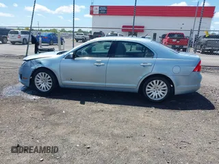 2010 Ford Fusion Hybrid z VIN 3FADP0L33AR385001, wystawiony jako IAAI lot #42074965 z przebiegiem 195 962 mil mil oraz . Historia ofert i sprzedaży dostępna na DreamBid. Obrazek 14.