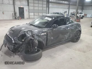 2012 MINI Coupe S z VIN WMWSX3C51CT408195, wystawiony jako Copart lot #77008744 z przebiegiem Nie podano mil oraz Szkody całkowita. Historia ofert i sprzedaży dostępna na DreamBid. Obrazek 1.
