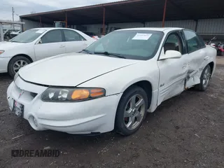 2004 Pontiac Bonneville SLE z VIN 1G2HY52K54U215710, wystawiony jako IAAI lot #41497635 z przebiegiem 123 343 mil mil oraz . Historia ofert i sprzedaży dostępna na DreamBid. Obrazek 2.