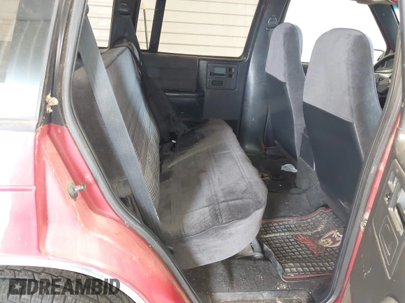 1993 Chevrolet Blazer z VIN 1GNDT13W2P2202181, wystawiony jako IAAI lot #42563244 z przebiegiem 143 439 mil mil oraz . Historia ofert i sprzedaży dostępna na DreamBid. Obrazek 8.