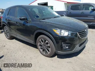 2016 Mazda CX-5 Grand Touring with VIN JM3KE4DY9G0893174, listed as a IAAI auction lot 41887814 with 79,811 mi miles. Bid and sale history available at carsss.com. Image 1.