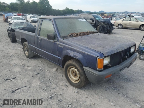 1995 Mitsubishi Mighty Max z VIN JA7LS21G4SP002839, wystawiony jako Copart lot #55777674 z przebiegiem Nie podano mil oraz Czysty tytuł • Clean title. Historia ofert i sprzedaży dostępna na DreamBid. Obrazek 4.