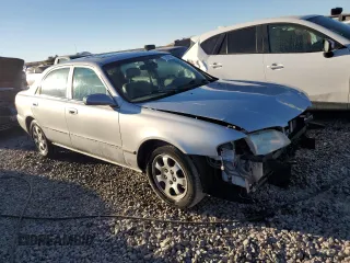 2001 Mazda 626 LX with VIN 1YVGF22C715241262, listed as a Copart auction lot 74259924 with 86,085 mi miles and Salvage Title. Bid and sale history available at carsss.com. Image 4.