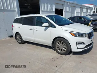 2021 Kia Sedona LX with VIN KNDMB5C12M6661917, listed as a IAAI auction lot 42129682 with 80,321 mi miles and . Bid and sale history available at carsss.com. Image 1.