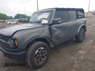 2021 Ford Bronco with VIN 1FMDE5DH9MLA62853, listed as a IAAI auction lot 42413256 with 65,000 mi miles and . Bid and sale history available at DreamBid. Image 2.