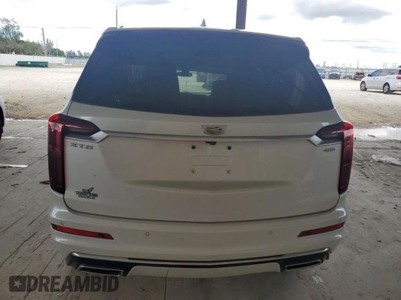 2023 Cadillac XT6 FWD Premium Luxury with VIN 1GYKPCRS4PZ103819, listed as a Copart auction lot 76279704 with 19,601 mi miles and Clean Title. Bid and sale history available at carsss.com. Image 6.