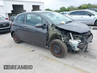 2015 Toyota Yaris L with VIN VNKJTUD32FA017299, listed as a IAAI auction lot 41862473 with 106,108 mi miles. Bid and sale history available at carsss.com. Image 1.