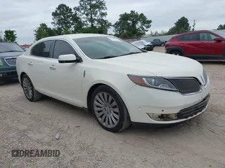 2013 Lincoln MKS with VIN 1LNHL9DKXDG604710, listed as a IAAI auction lot 42001875 with 117,724 mi miles and . Bid and sale history available at DreamBid. Image 1.
