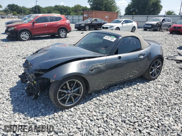 2020 Mazda MX-5 Miata Grand Touring z VIN JM1NDAD77L0414873, wystawiony jako Copart lot #54767785 z przebiegiem 47 579 mil mil oraz Szkoda całkowita • Salvage title. Historia ofert i sprzedaży dostępna na DreamBid. Obrazek 1.
