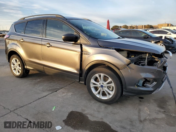 2017 Ford Escape SE with VIN 1FMCU0G91HUE07265, listed as a Copart auction lot 84231444 with 82,990 mi miles and Clean Title. Bid and sale history available at DreamBid. Image 4.