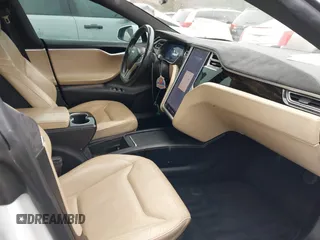 2016 Tesla Model S 90D with VIN 5YJSA1E26GF155962, listed as a IAAI auction lot 41348998 with 134,269 mi miles and . Bid and sale history available at DreamBid. Image 5.