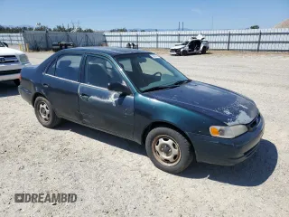 1999 Toyota Corolla VE с VIN 1NXBR12E4XZ240034, выставлен на аукционе Copart как лот 55860355 с пробегом 252 442 миль миль и Списание • Salvage title. История ставок и продаж доступна на DreamBid. Изображение 4.