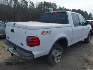 2003 Ford F-150 XLT with VIN 1FTRW08L73KA73945, listed as a IAAI auction lot 41474904 with 122,080 mi miles. Bid and sale history available at carsss.com. Image 4.