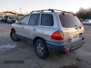 2003 Hyundai Santa Fe GLS with VIN KM8SC73D73U518784, listed as a IAAI auction lot 41348907 with 127,980 mi miles. Bid and sale history available at carsss.com. Image 3.